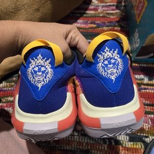 Nike Blue and Orange Athletic Shoes with Lion Design